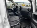 Interior view of a 2019 Mercedes-Benz Metris showing two front seats dashboard and control panel