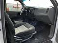 Interior view of a 2010 Ford Ranger showing two front seats and the dashboard with various controls and displays