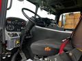 Interior view of a 2009 Spartan Gladiator fire truck showing the steering wheel dashboard and driver's seat