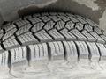 Close-up of a tread pattern on a tire from a 2004 Ford Explorer Sport Trac showing detailed grooves and ridges designed for traction