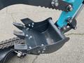 Close-up of the bucket attachment of a 2024 AGT Mini Excavator showcasing its metal construction and bolt fittings