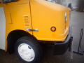 A yellow 2008 Freightliner MT45 Chassis with a rounded front and white wheels visible