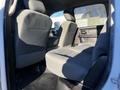 Interior view of a 2014 RAM 5500 showing rear seats with gray fabric upholstery and a spacious cabin area