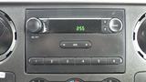 Dashboard of a 2008 Ford F-450 SD featuring a radio and climate control buttons with a digital clock displaying 255