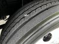 Close-up of a 2022 Isuzu NPR tire showing tread patterns and texture