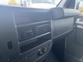 Dashboard of a 2012 Chevrolet Express featuring air vents and control knobs