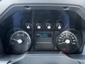 Dashboard of a 2011 Ford F-750 showing the speedometer fuel gauge and trip information display