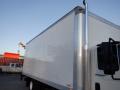 A 2014 International Durastar truck with a large blank cargo box and a shiny exhaust pipe on the side