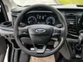 The interior view of a 2020 Ford Transit showing the steering wheel with Ford logo and dashboard displays