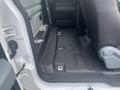 Interior view of a 2013 Ford F-150 showing the rear seating area with a focus on the flat floor and seat configuration