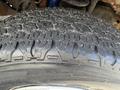 Close-up of a textured tire tread from a 2008 Ford Econoline showcasing detailed patterns and grooves