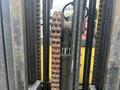 Close-up of a 2000 Hyster 120 forklift's chain and lift mechanism showing gears and metal components