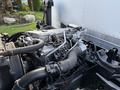 Engine of a 2007 GMC W5500 18 Foot Cube Van with visible components including pipes and wiring