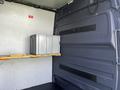 A 2017 Mercedes-Benz Sprinter interior showing a metal storage container on a wooden shelf against the wall