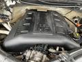 Engine compartment of a 2016 Ford F-150 featuring a V6 engine cover with embossed text indicating 3.5L and labeled components for maintenance