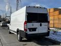 A white 2017 RAM Promaster van parked on the street showing a solid rear design with a large cargo space and no visible branding on the back