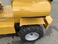 2024 AGT Industrial KRW23 Mini Loader with large black tire and yellow metal body showing wheel attachment and operational components