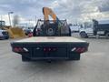 A 2017 Ford F-550 with a flatbed truck design visible from the rear showing taillights and a hitch attachment