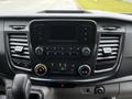 Dashboard of a 2020 Ford Transit with a touchscreen display and control knobs for climate and audio settings