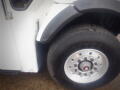 Close-up of the front wheel and tire of a 2008 International 7400 truck showing the Goodyear tire and alloy wheel design