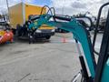 2024 AGT Industrial QH13R Mini Excavator with a teal arm and claw attachment poised for operation