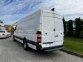 A 2016 Mercedes-Benz Sprinter van in white with a high roof and rear doors closed