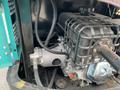 A close-up view of the engine compartment of a 2024 AGT Industrial QH13R Mini Excavator showcasing the engine and associated components