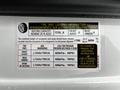 Tire and loading information label on a 2021 Mercedes-Benz Sprinter detailing seating capacity and tire specifications