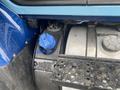 Close-up of a fuel tank with a blue cap and metallic tank surface on a 2016 International 7400 truck