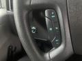 Steering wheel controls for cruise control on a 2017 Chevrolet Express with buttons for increasing speed setting and resume functions