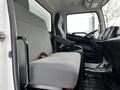 Interior view of a 2019 Hino 338 featuring a gray driver's seat and a spacious passenger bench seat with seat belts