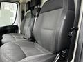 The interior of a 2018 RAM Promaster featuring two driver and passenger seats with black fabric upholstery