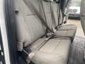The interior of a 2017 Ford F-550 showing the rear bench seat with seatbelts and a textured fabric surface