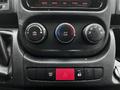 The dashboard controls of a 2018 RAM Promaster featuring knobs for temperature adjustment air conditioning and various system functions