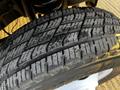 A close-up of a 2017 Ford Econoline tire showing detailed tread patterns and surface wear