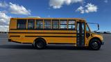 A side view of a 2014 Freightliner Thomas Diesel school bus with a yellow exterior and multiple windows