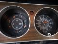 Dashboard gauges of a 1974 Dodge Challenger displaying fuel oil temperature and altimeter readings