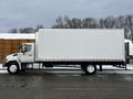 A 2019 Hino 338 24-foot cube truck with a white box body and a grey cab positioned on a paved surface