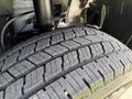 The close-up view of a tire from a 2019 Mercedes-Benz Sprinter showing its tread pattern and rubber texture