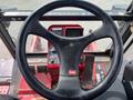 View of the steering wheel and control panel of a 2012 Toro Groundsmaster 5910 with various switches and a digital display