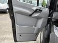 The image shows the interior door panel of a 2017 Mercedes-Benz Sprinter with a sleek gray design and a built-in storage compartment