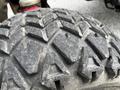 Close-up of a worn tire tread from a 2012 Toro Groundsmaster showcasing deep grooves and patterns designed for traction on grass and uneven terrain