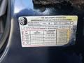 A tire information label from a 2014 Ford F-250 SD detailing seating capacity tire sizes and pressure specifications