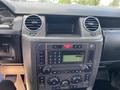 Dashboard of a 2006 Land Rover LR3 featuring a digital display radio climate control knobs and various buttons for vehicle functions