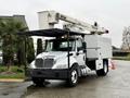 A 2020 International MV607 bucket truck with a white body and a raised hydraulic lift arm for reaching high areas