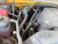 A 2013 Chevrolet Silverado 1500 engine compartment with visible parts including hoses wires and the engine block