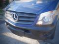 Front view of a blue 2017 Mercedes-Benz Sprinter showcasing the iconic logo grille and headlights