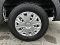 Close-up of a silver wheel with a modern design and a black tire from a 2020 Ford Transit