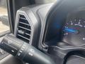 Close-up of the dashboard of a 2017 Ford F-550 showing the speedometer and an air vent with a control stalk for lights and turn signals