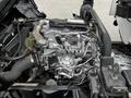 Close-up of a 2014 Hino 195 engine showing various components including pipes wires and a silver fuel rail